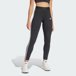 Legginsy LOUNGEWEAR Essentials 3-Stripes. Białe legginsy adidas, bez wzorów, klasyczne. Za 109.00 zł.
