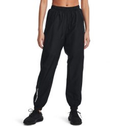 Spodnie dresowe damskie Under Armour Rush Woven Pant. Czarne spodnie dresowe Under Armour, bez wzorów, z dresówki. Za 219.99 zł.