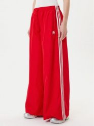 Adidas Spodnie dresowe adicolor Firebird JD3388 Czerwony Loose Fit. Czerwone spodnie dresowe adidas, bez wzorów, z dresówki. Za 329.99 zł.