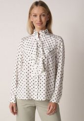 Biała Wiskozowa Koszula w Kropki ze Stójką z Ozdobnymi Falbanami Isamene. Białe koszule Born2be, m, bez wzorów, z jeansu, klasyczne, bez kołnierzyka, bez ramiączek. Za 129.99 zł.