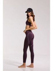 Onamaste Legginsy sportowe "Karma" w kolorze fioletowym rozmiar: L/XL. Różowe legginsy Onamaste, l, bez wzorów, z materiału, z podwyższonym stanem, outdoorowe. Za 139.95 zł.