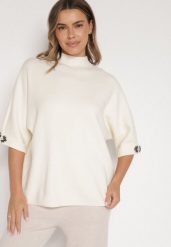 Jasnobeżowy Sweter Ozdobiony na Rękawach Cyrkoniami Aletusa. Brązowe swetry Born2be, z aplikacjami, z jeansu, eleganckie, bez ramiączek. Za 99.99 zł.