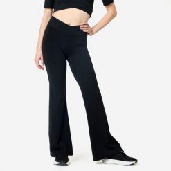 Legginsy fitness damskie Domyos. Czarne legginsy Decathlon, bez wzorów, z elastanu, sportowe. Za 129.99 zł.