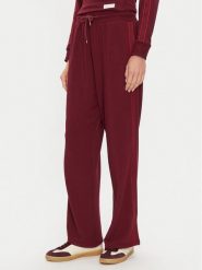 Tommy Hilfiger Spodnie dresowe UW0UW04771 Bordowy Relaxed Fit. Czerwone spodnie dresowe Tommy Hilfiger, bez wzorów, z dresówki. Za 219.99 zł.