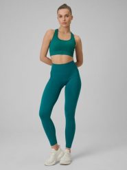 4F Legginsy treningowe bezszwowe damskie - turkusowe XS/S. Niebieskie legginsy 4f, bez wzorów, z dzianiny. Za 149.99 zł.