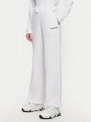 Tommy Hilfiger Spodnie dresowe UW0UW05577 Biały Relaxed Fit. Białe spodnie dresowe Tommy Hilfiger, bez wzorów, z bawełny. Za 179.99 zł.