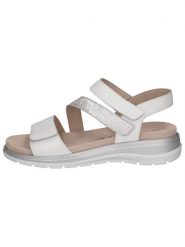 Caprice Skórzane sandały w kolorze srebrno-białym na koturnie rozmiar: 40. Białe sandały Caprice, bez wzorów, z otwartym noskiem, bez obcasa, na koturnie, bez zapięcia. Za 171.28 zł.