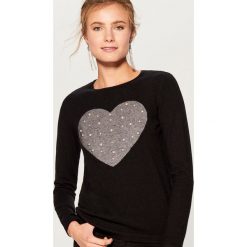 Sweter z biżuteryjną aplikacją - Czarny. Swetry marki INESIS. W wyprzedaży za 59.99 zł.