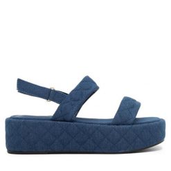 Sandały JENNY. Niebieskie sandały Jenny, bez wzorów, bez obcasa, na koturnie, bez zapięcia. Za 129.99 zł.