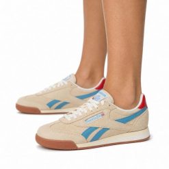 Buty damskie sneakersy sportowe Reebok SS-CAMPIO XT. Brązowe buty treningowe Reebok, bez wzorów, z gumy, bez zapięcia, do piłki nożnej. Za 175.00 zł.
