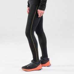 Legginsy do biegania w terenie damskie Kiprun Run 900. Czarne legginsy EVADICT, bez wzorów, z materiału, długie. Za 149.99 zł.