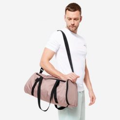 Torba fitness Domyos 20 l. Brązowe torby sportowe DOMYOS, bez wzorów, z materiału, na ramię, średnie. Za 39.99 zł.