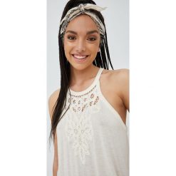 Superdry top z domieszką lnu kolor beżowy. Brązowe topy Superdry, l, bez wzorów, z dzianiny, bez kołnierzyka, bez ramiączek. W wyprzedaży za 134.99 zł.