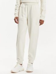Asics Spodnie dresowe Logo 2032C844 Beżowy Regular Fit. Brązowe spodnie dresowe ASICS, bez wzorów, z bawełny. Za 259.99 zł.
