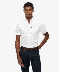 Superdry Koszula Oxford krótkiego rękawa z bawełny organicznej. Białe koszule Superdry, m, bez wzorów, z bawełny, casualowe, bez kołnierzyka, bez ramiączek. Za 280.80 zł.