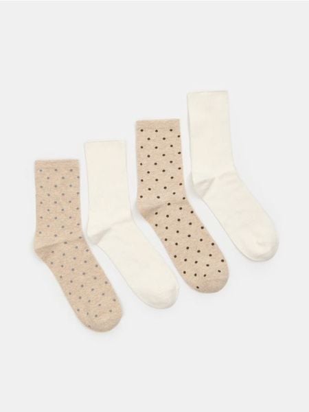 Skarpetki z bawełną 4 pack - kremowy. Białe skarpetki Sinsay, bez wzorów, z bawełny. Za 15.99 zł.