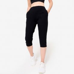 Krótkie legginsy fitness damskie Domyos. Czarne legginsy DOMYOS, bez wzorów, z bawełny, sportowe, krótkie. Za 59.99 zł.