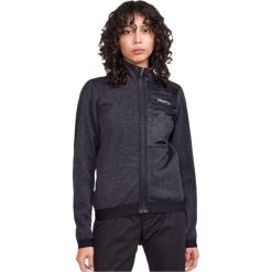 Damska bluza dresowa Craft ADV Gravel. Czarne bluzy Craft, bez wzorów, z dresówki, sportowe, bez ramiączek, bez kaptura. Za 664.25 zł.