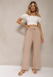 Beżowe Bawełniane Spodnie Palazzo High Waist z Gumką w Pasie Gitanea. Brązowe jeansy Renee, xl, bez wzorów, z bawełny, eleganckie, z podwyższonym stanem. W wyprzedaży za 17.99 zł.