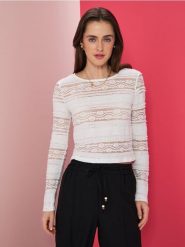 Ażurowa bluzka - kremowy. Białe bluzki Sinsay, l, w ażurowe wzory, bez kołnierzyka, bez ramiączek. Za 35.99 zł.