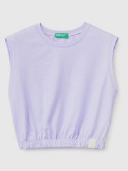 Benetton Top w kolorze fioletowym rozmiar: 150. Różowe topy Benetton, bez wzorów, z bawełny, bez kołnierzyka, bez ramiączek. Za 33.06 zł.