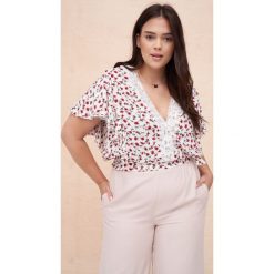 Bluzka Damska Hausi Plus Size Reddsi Flowers. Czarne bluzki blue shadow, plus size, bez wzorów, z koronki, bez kołnierzyka, plus size, bez ramiączek. W wyprzedaży za 99.95 zł.