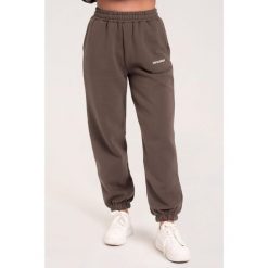 Spodnie fitness damskie Gym Glamour dresowe. Brązowe spodnie sportowe GYM GLAMOUR, bez wzorów, z dresówki, na fitness i siłownię. Za 189.99 zł.