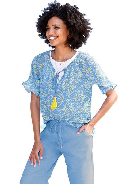 Heine Bluzka w kolorze błękitnym rozmiar: 36. Niebieskie bluzki Heine, bez wzorów, bez kołnierzyka, bez ramiączek. Za 48.16 zł.