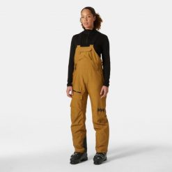 Damskie spodnie narciarskie na szelkach Helly Hansen Powderqueen. Brązowe spodnie narciarskie Helly Hansen, bez wzorów, narciarskie. W wyprzedaży za 1,208.00 zł.