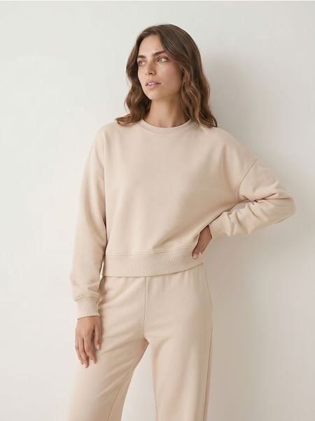 Krótka bluza crewneck - beżowy. Brązowe bluzy Sinsay, l, bez wzorów, bez kaptura. Za 49.99 zł.