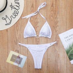 Bikini z cyrkoniami na plażę z regulowanymi ramiączkami Sivan. Czarne bikini Intica, bez wzorów, z materiału, eleganckie. Za 149.00 zł.