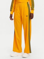 Adidas Spodnie dresowe adicolor Classic Firebird JP2316 Żółty Loose Fit. Żółte spodnie dresowe adidas, bez wzorów, z dresówki. Za 219.99 zł.