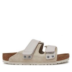 Klapki Birkenstock. Brązowe klapki Birkenstock, bez wzorów, bez obcasa, bez zapięcia. Za 629.99 zł.