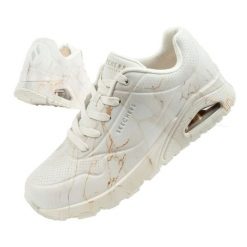Buty Skechers Uno 155584/OFWT białe. Białe buty treningowe bez wzorów, ze skóry, bez zapięcia, trekkingowe. W wyprzedaży za 511.39 zł.