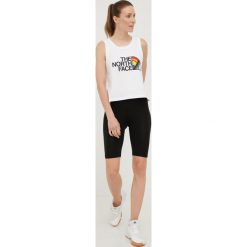 The North Face top bawełniany Pride kolor biały. Białe topy The North Face, l, bez wzorów, z bawełny, bez kołnierzyka, bez ramiączek. W wyprzedaży za 84.99 zł.