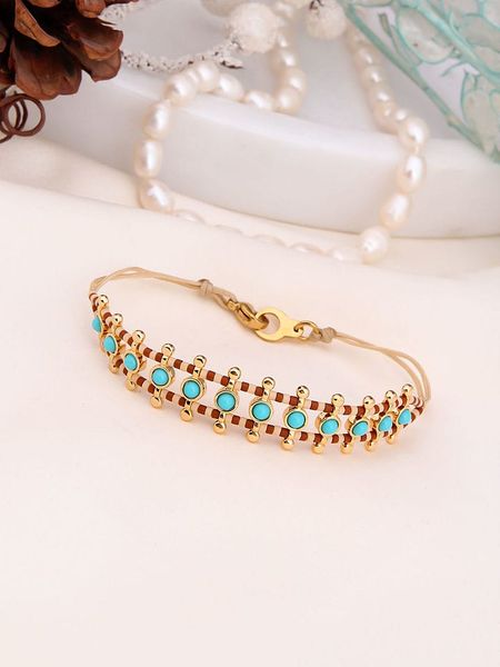 Charlize Pozłacana bransoletka z kamieniami szlachetnymi rozmiar: onesize. Brązowe bransoletki Charlize, z jaspisem, pozłacane. Za 104.89 zł.