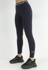 Granatowe Legginsy z Napisem Vaya. Niebieskie legginsy Born2be, bez wzorów, z dzianiny. W wyprzedaży za 44.99 zł.