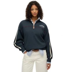Sweter z kołnierzem tunezyjskim damski Superdry Country Club Tape. Niebieskie swetry Superdry, na zimę, bez wzorów, bez ramiączek. Za 346.45 zł.