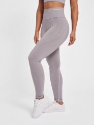 Legginsy damskie Hummel MT Flow. Fioletowe legginsy Hummel, bez wzorów, z dzianiny, sportowe. Za 229.85 zł.