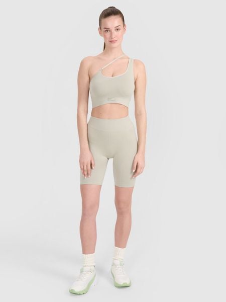4F Legginsy kolarki bezszwowe treningowe damskie - beżowe M/L. Brązowe legginsy 4f, bez wzorów. W wyprzedaży za 59.99 zł.
