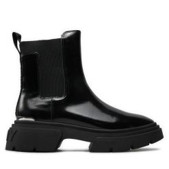 Sztyblety DKNY. Czarne botki DKNY, bez wzorów, bez obcasa, na płaskiej podeszwie, bez zapięcia. Za 419.99 zł.