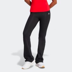 Legginsy fitness damskie ADIDAS flare. Czarne legginsy adidas, bez wzorów, z bawełny, długie. Za 119.99 zł.