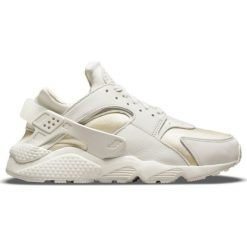 Buty Nike Air Huarache W DQ0916-001 białe złoty. Białe buty treningowe Nike, bez wzorów, z gumy, bez zapięcia. Za 957.50 zł.