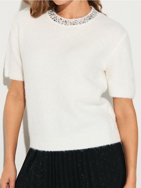 Bluzka swetrowa z domieszką wełny - kremowy. Białe bluzki Sinsay, l, bez wzorów, z wełny, bez kołnierzyka, bez ramiączek. Za 49.99 zł.