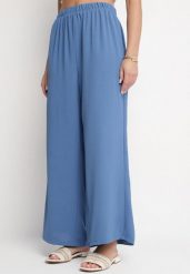 Niebieskie Spodnie Palazzo o Szerokim Kroju z Wysokim Stanem Aravenna. Niebieskie jeansy Born2be, z aplikacjami, z jeansu, eleganckie, z podwyższonym stanem. Za 69.99 zł.