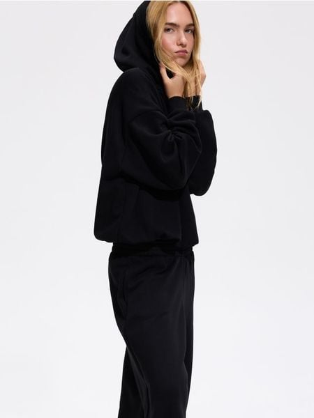 Bluza z kapturem - czarny. Czarne bluzy Reserved, l, bez wzorów, z bawełny, z kapturem. Za 129.99 zł.