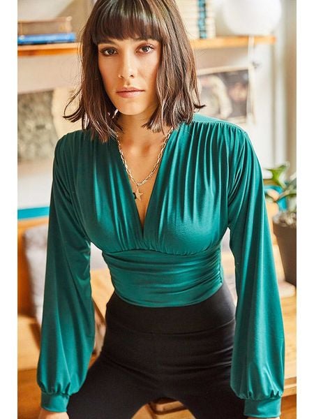 Olalook Bluzka w kolorze turkusowym rozmiar: M. Niebieskie bluzki Olalook, m, bez wzorów, bez kołnierzyka, bez ramiączek. Za 66.00 zł.