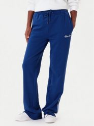 Guess Jeans Spodnie dresowe W5YB32 K68I4 Niebieski Regular Fit. Niebieskie spodnie dresowe Guess Jeans, z aplikacjami, z bawełny. Za 299.99 zł.