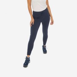Legginsy turystyczne damskie Quechua NH100. Niebieskie legginsy QUECHUA, bez wzorów, z elastanu, sportowe. Za 99.99 zł.