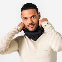 Komin do biegania Kiprun Warm+ ocieplany. Czarne szaliki i kominy KIPRUN, bez wzorów, z materiału, eleganckie. Za 44.99 zł.